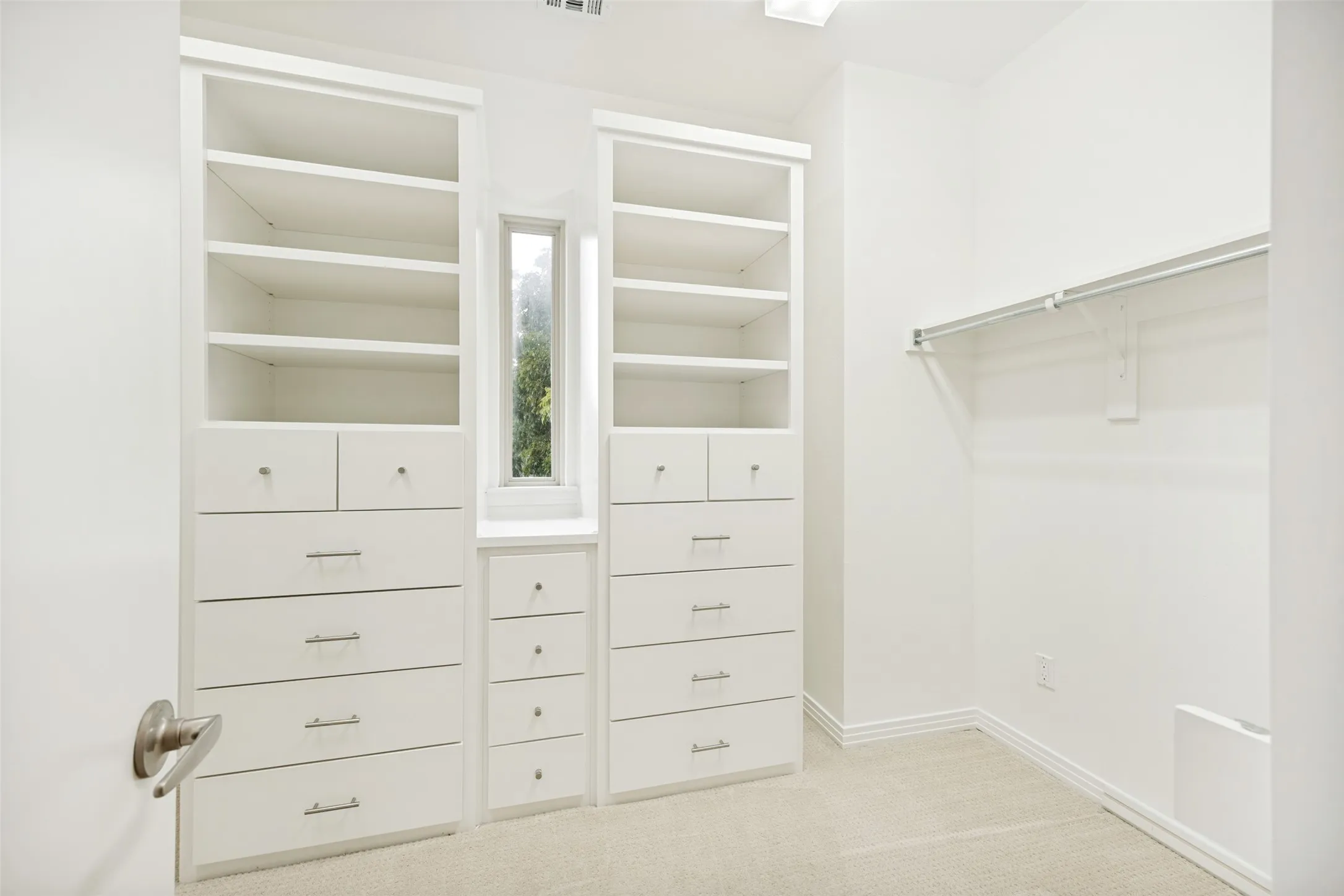 Primary bedroom walk in closet