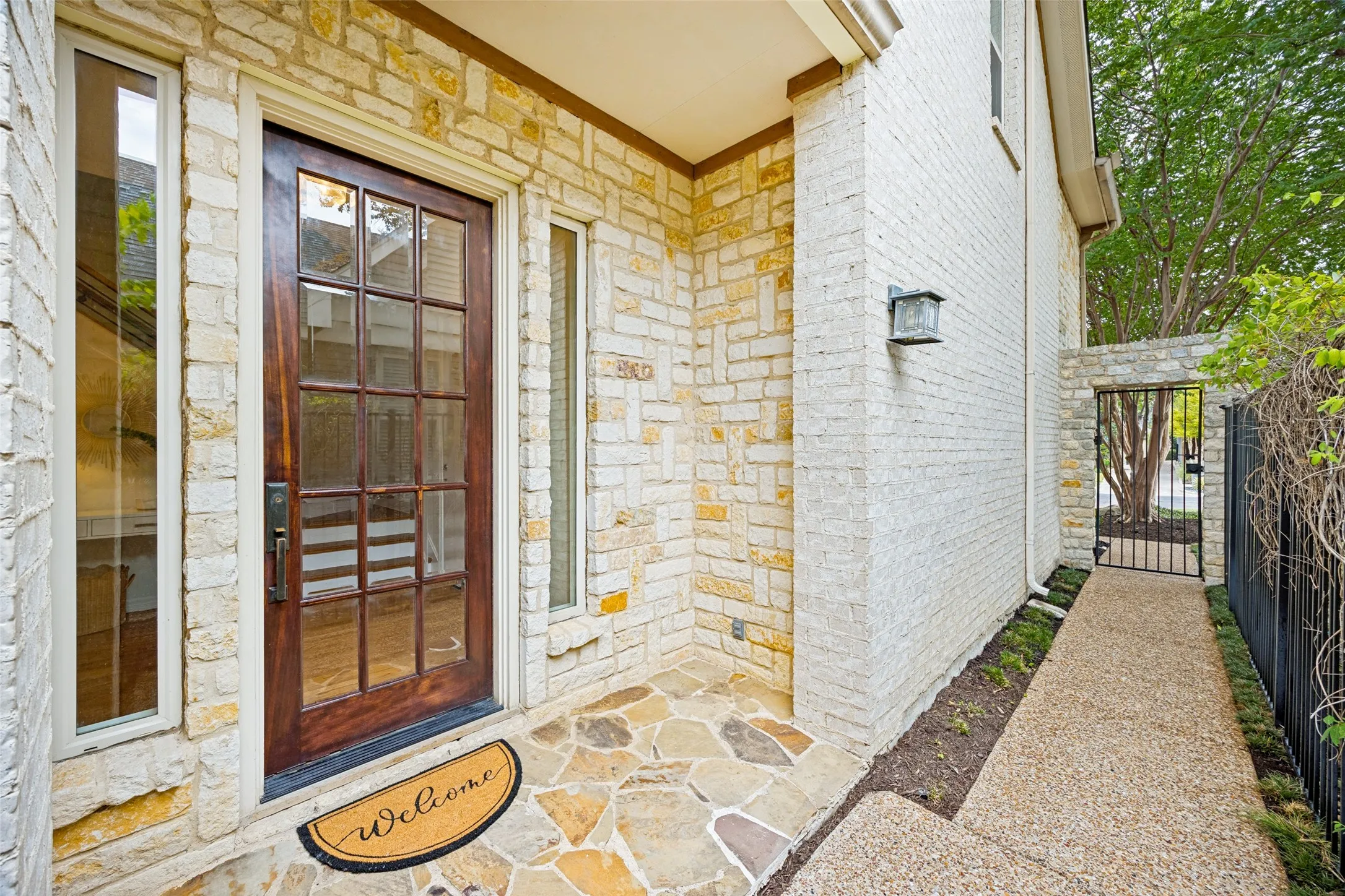Private front entry with rod iron gate