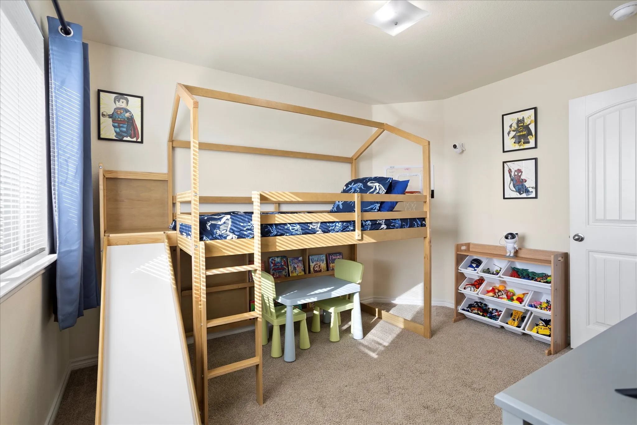 Carpeted flooring with light-toned wall paint and an overhead light fixture