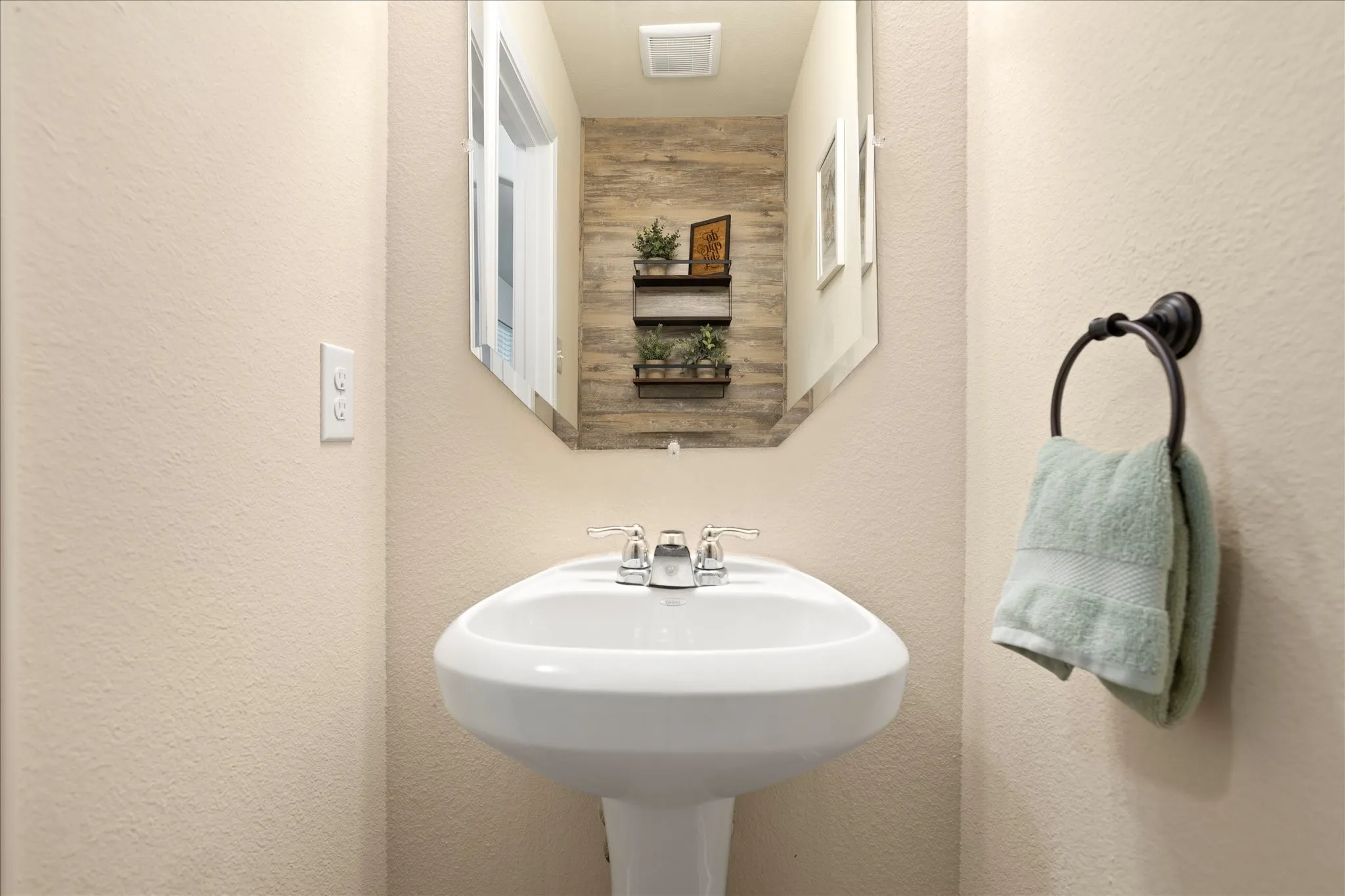 Pedestal sink with chrome faucet