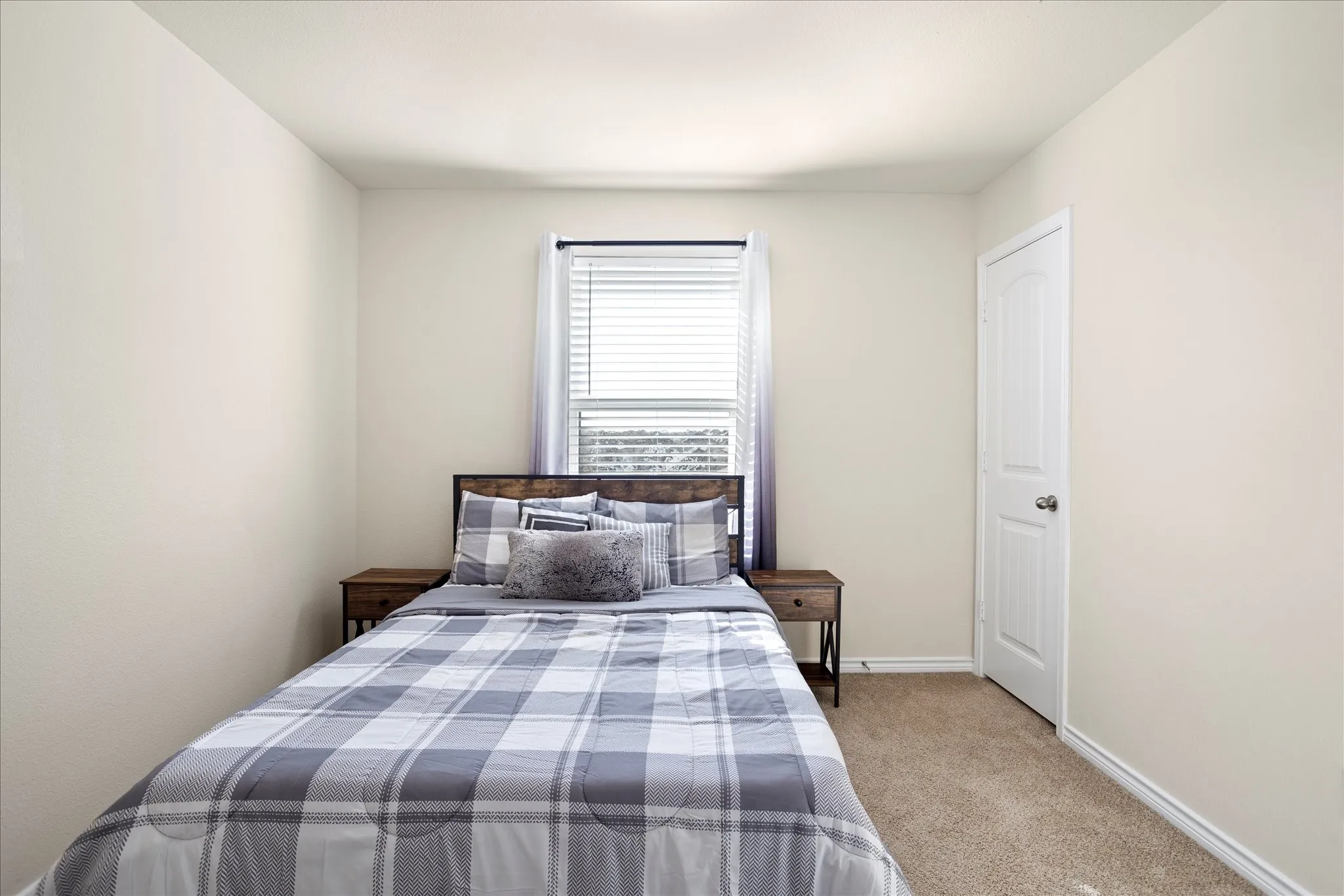 Neutral-toned walls with carpeted flooring