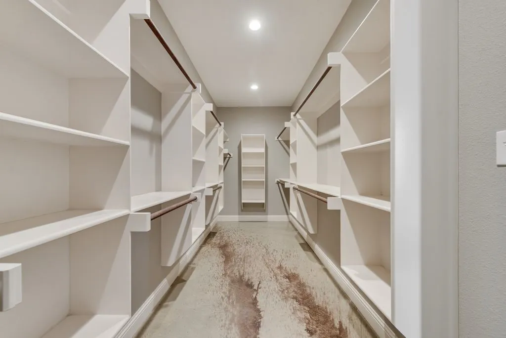 This primary closet as a custom design. There is plenty of room for all your boots, hats and blue jeans.