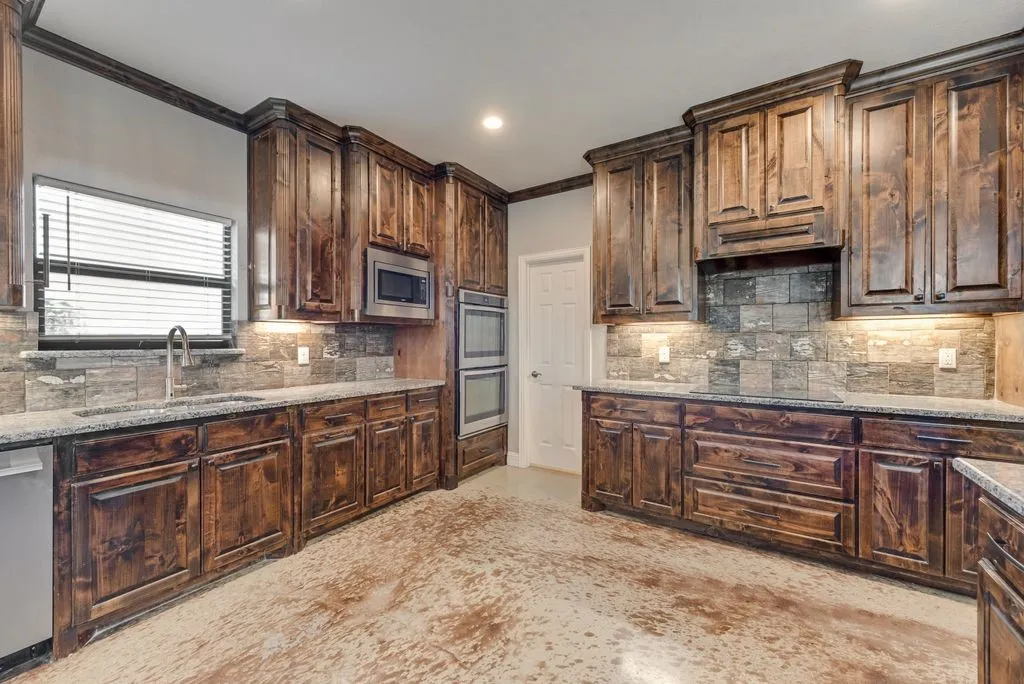 The spacious kitchen has an abundance of Cabinets.