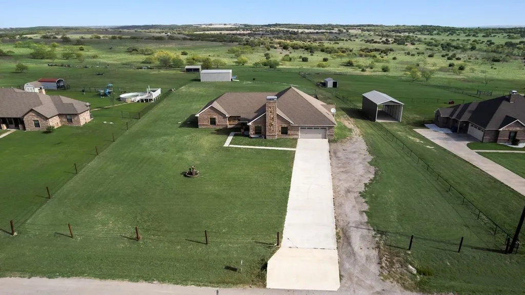 Over 2 acres. Room for your livestock, home business and no HOA.