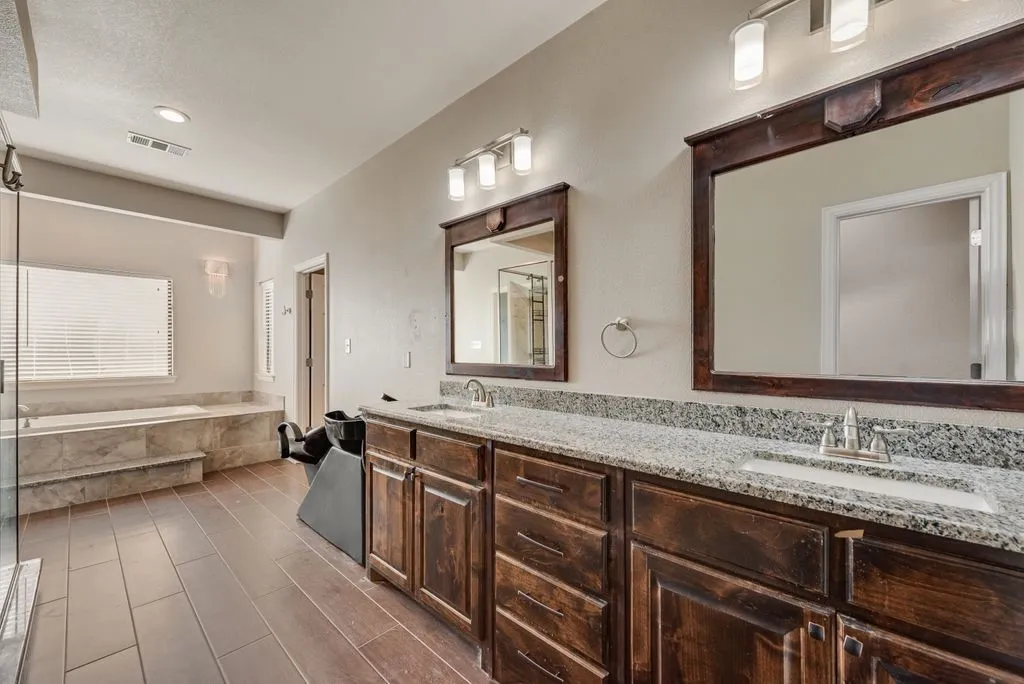 This primary bathroom is set up with a hair washing station. Another opportunity for a home business.
