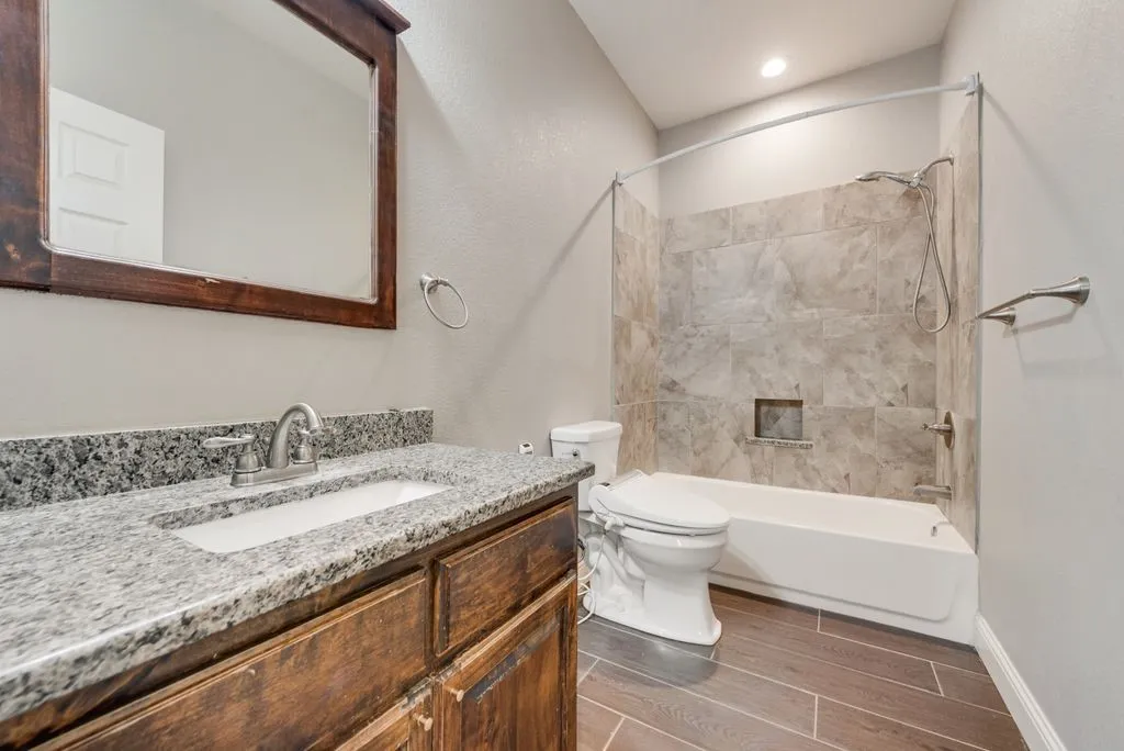 Bathroom two serves the secondary bedrooms, but there’s a half bath off the living space as well. All bathrooms are set up with a heated bidet feature.