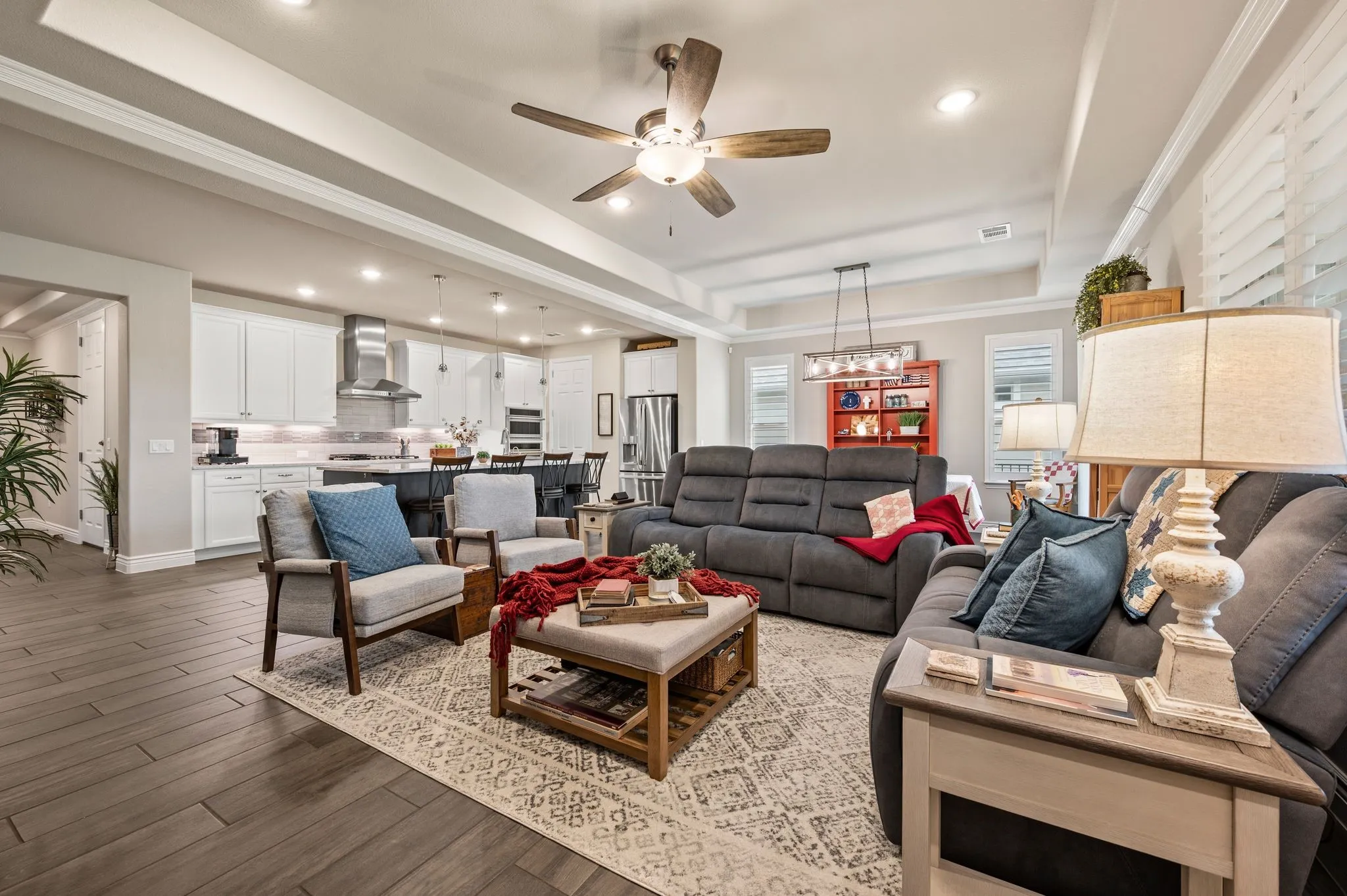 Open floor plan with large tray ceiling over living and dining rooms