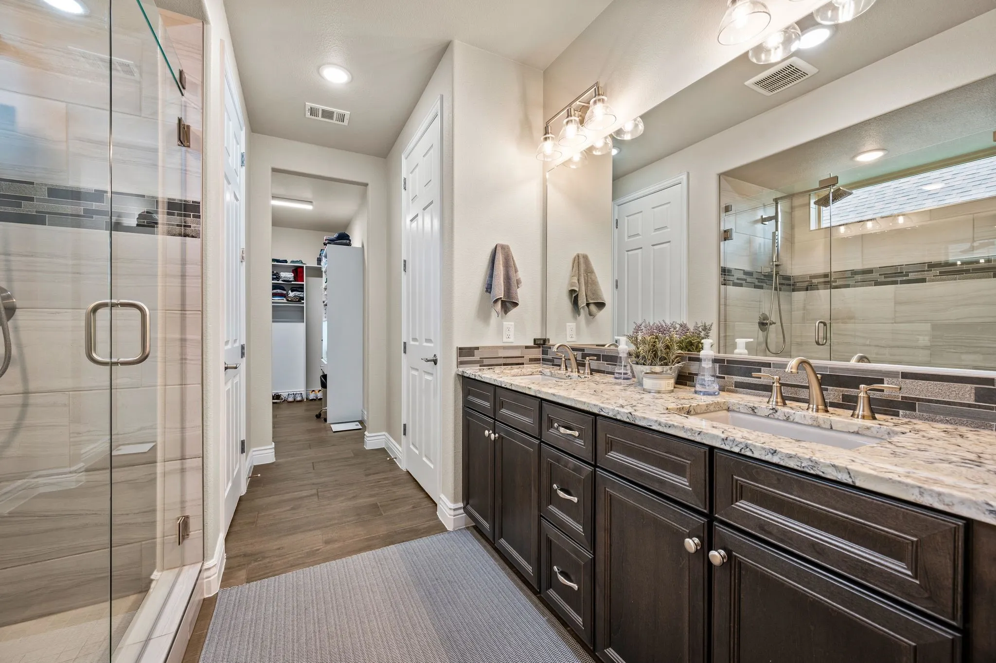 Large primary bath with walk in showers and upgrades