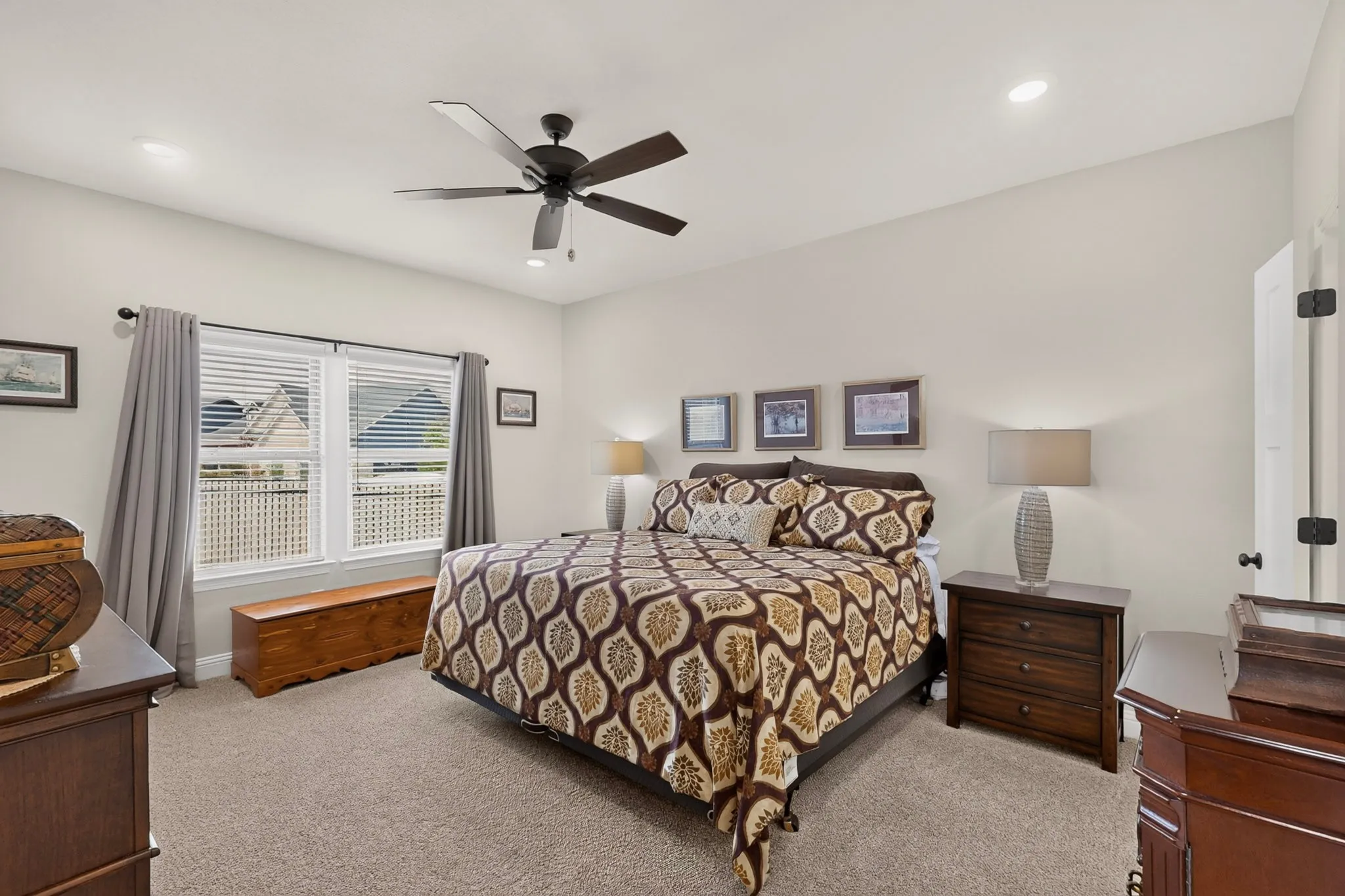 Plush carpet flooring, recessed lighting, ceiling fan, and window blinds