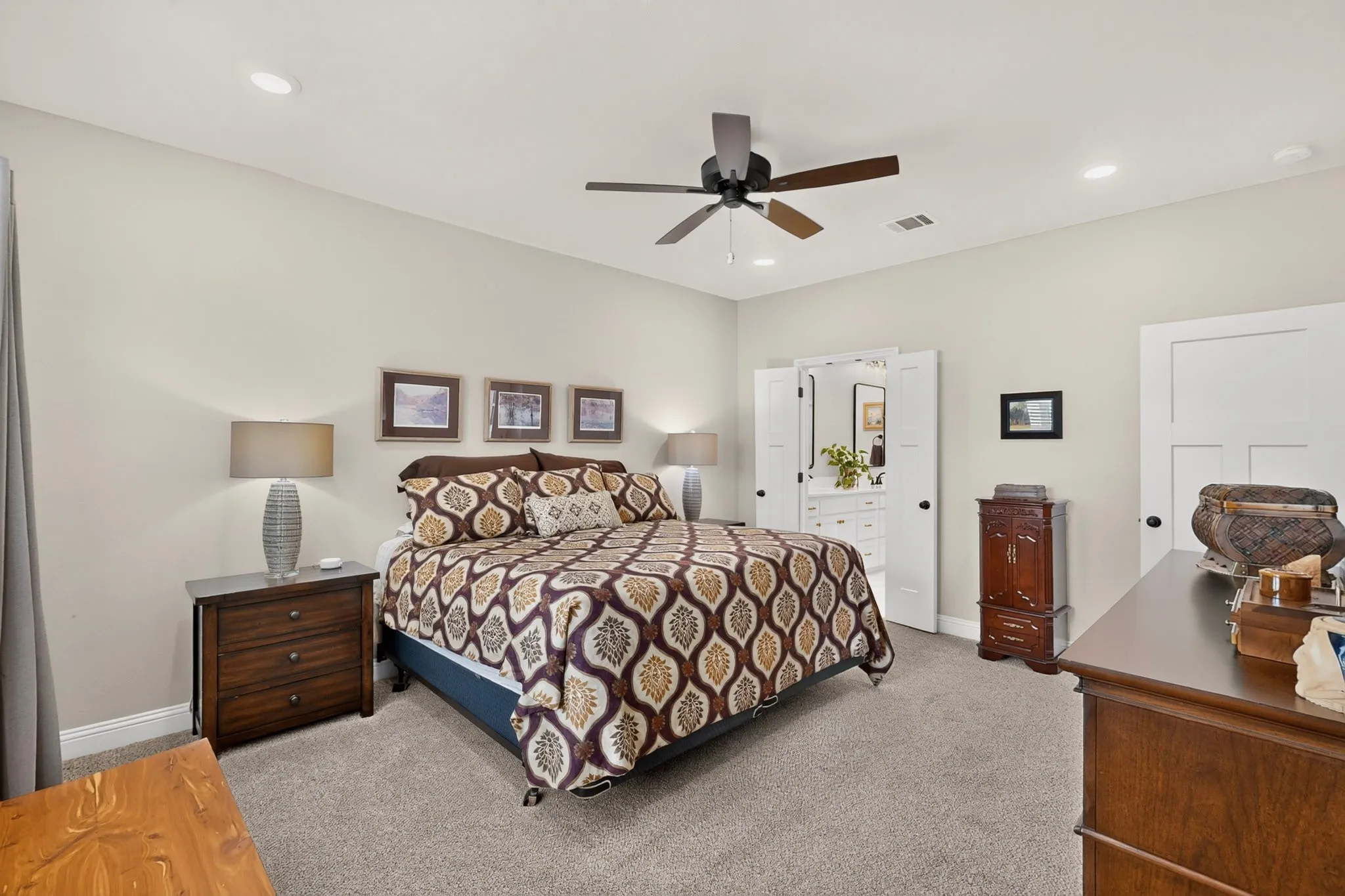 Recessed lighting, ceiling fan, neutral wall tones, and plush carpet flooring