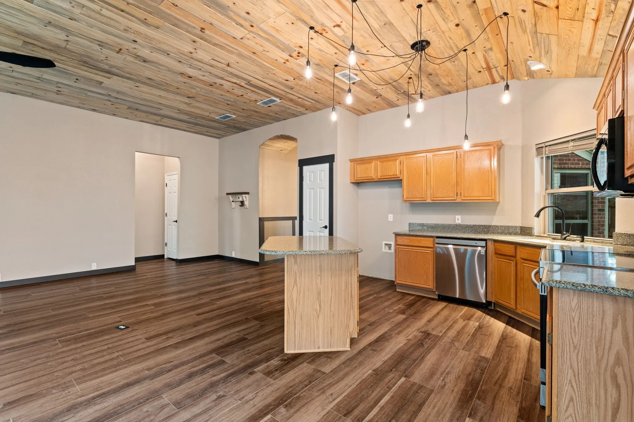 Wood-finish plank flooring throughout