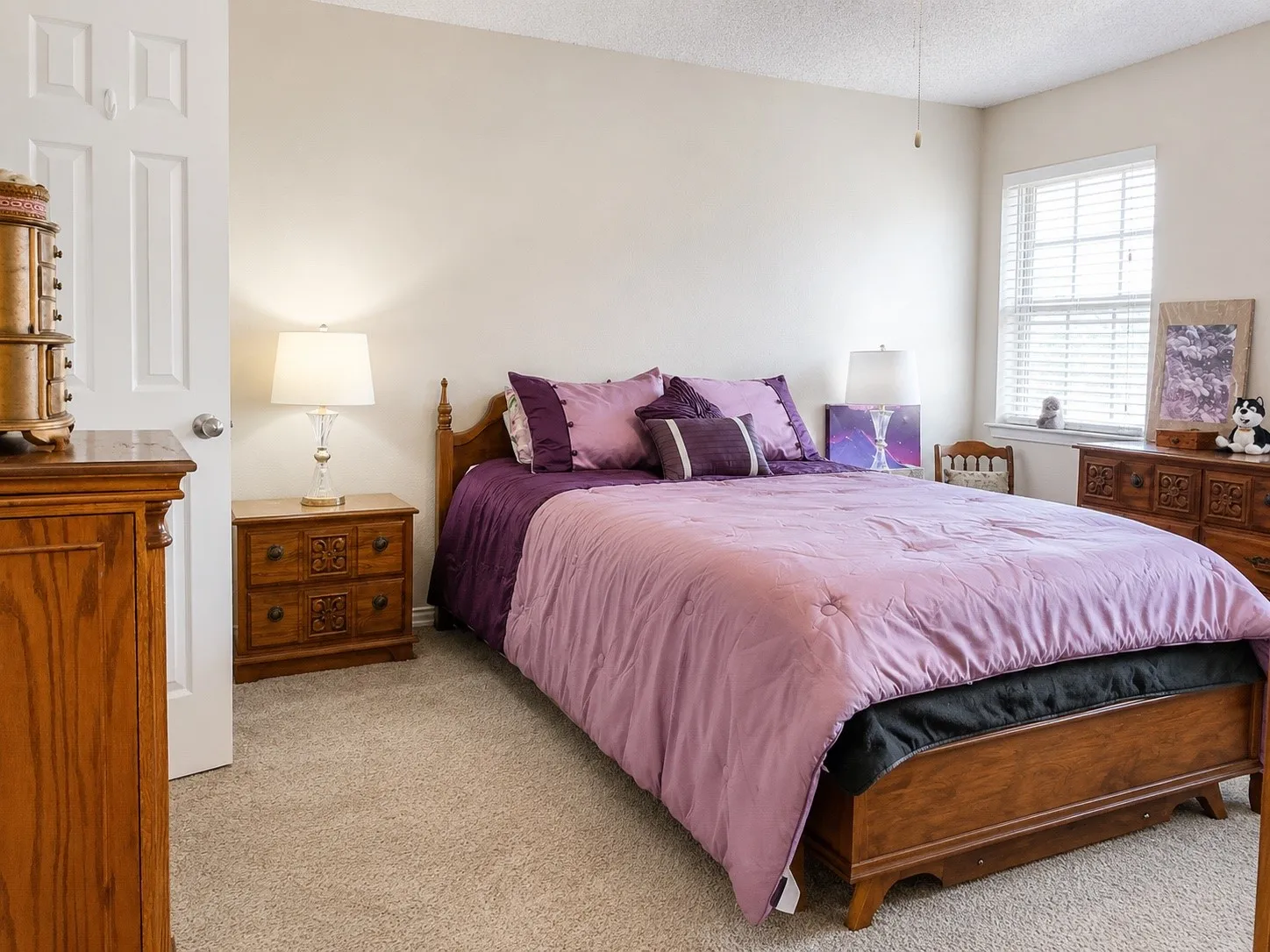 Wall-to-wall carpeting and a ceiling-mounted light fixture