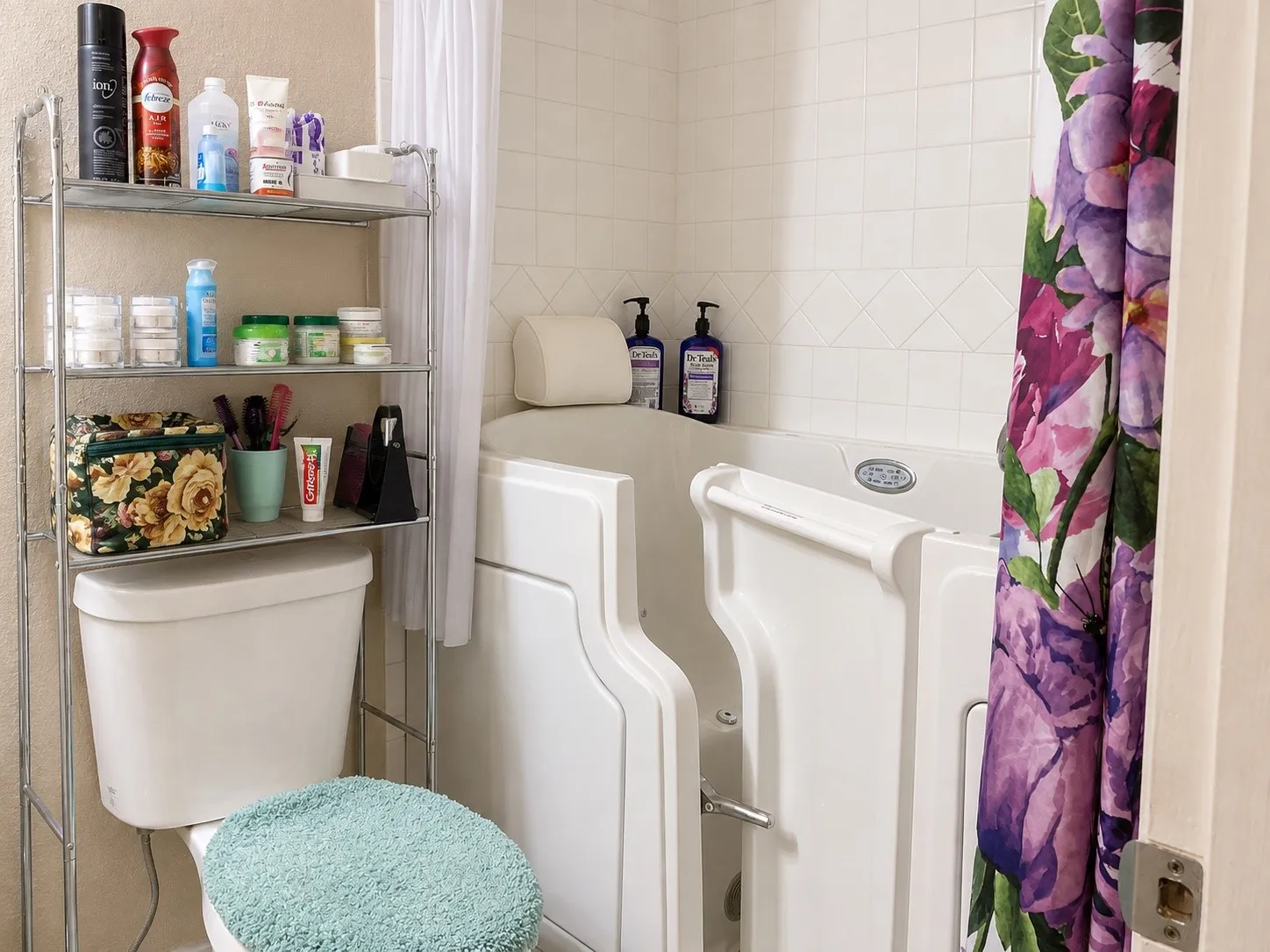 Accessible walk-in tub with grab bar and tile surround