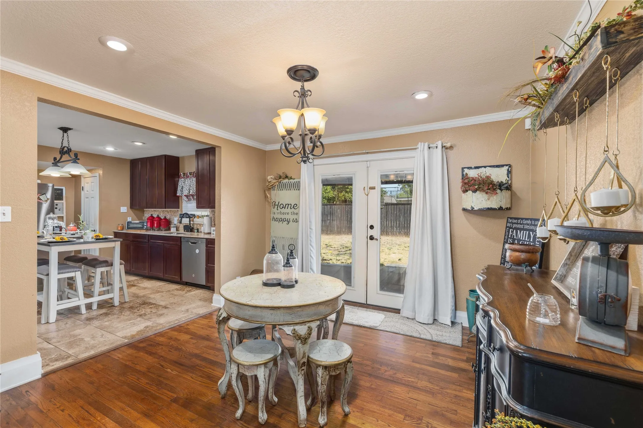 Open concept to kitchen with one of dining rooms