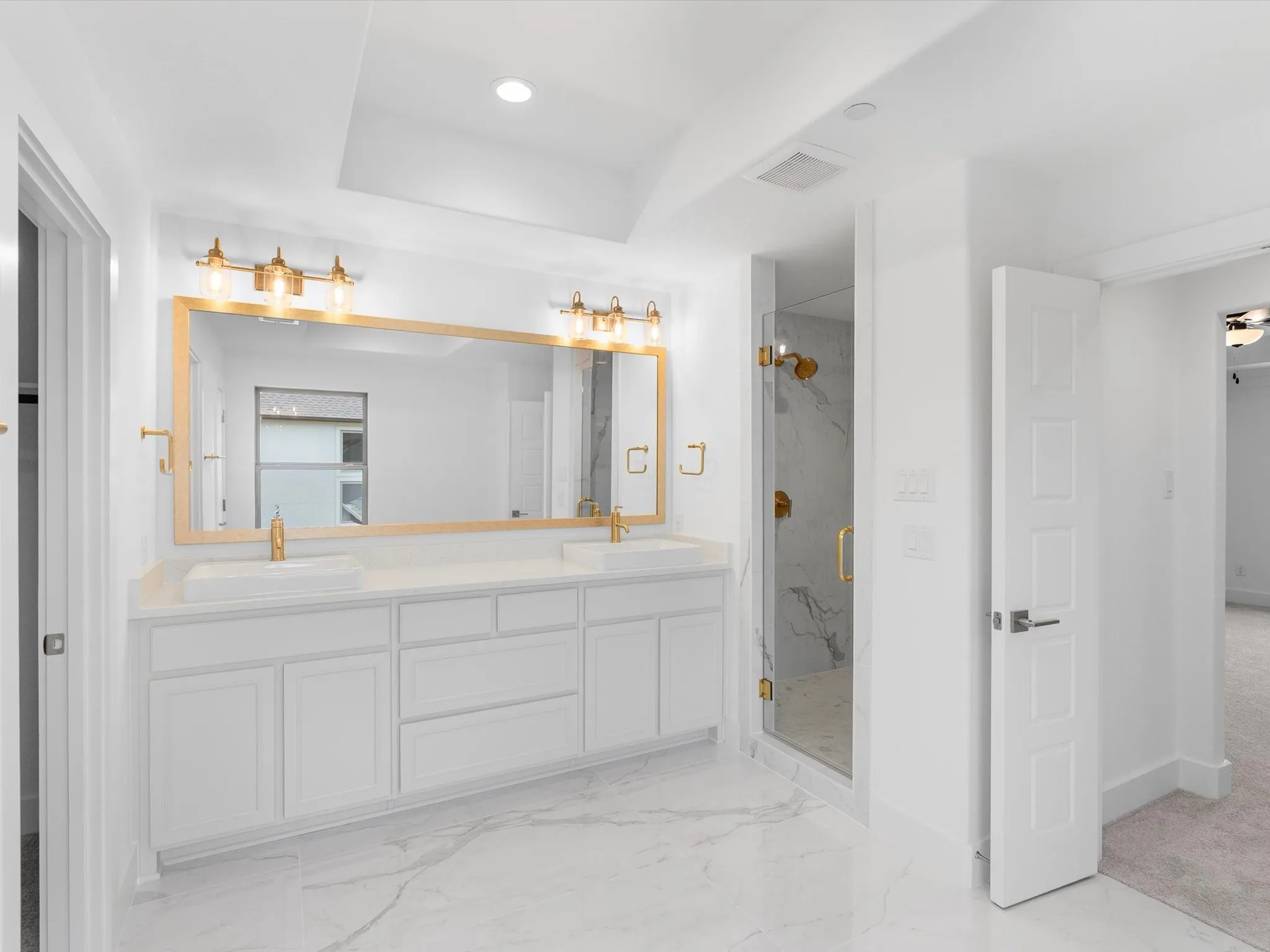 Dual vessel sinks set in an extended vanity with ample storage