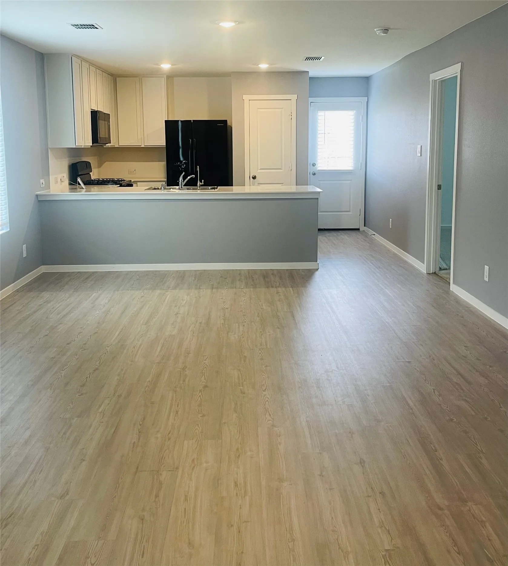 Open concept from living room to kitchen.