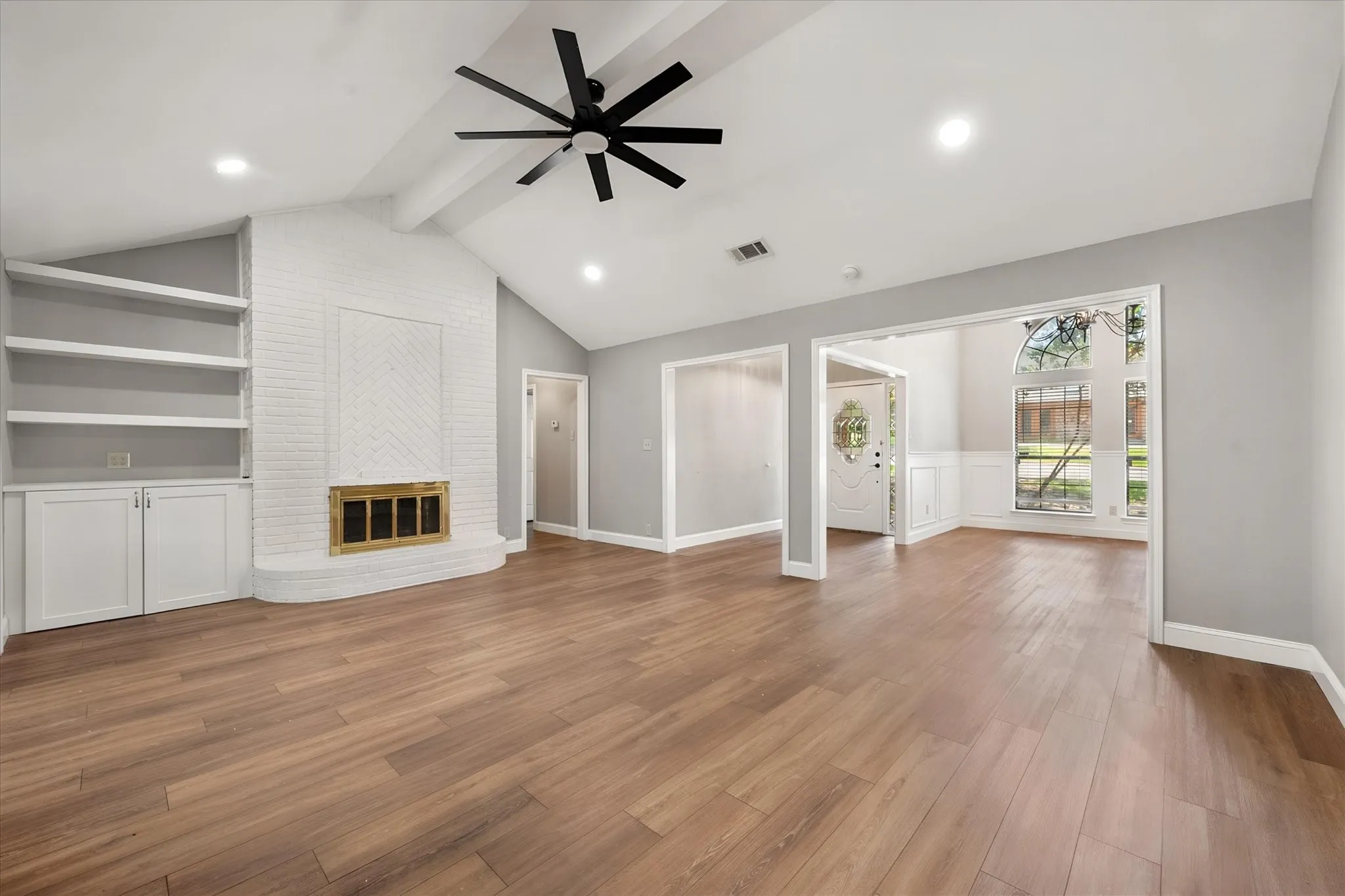 Living room with focal fireplace and storage