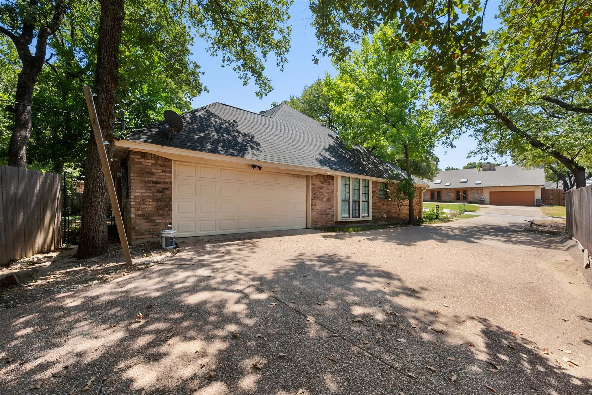 Large driveway with side entry garage and extra parking