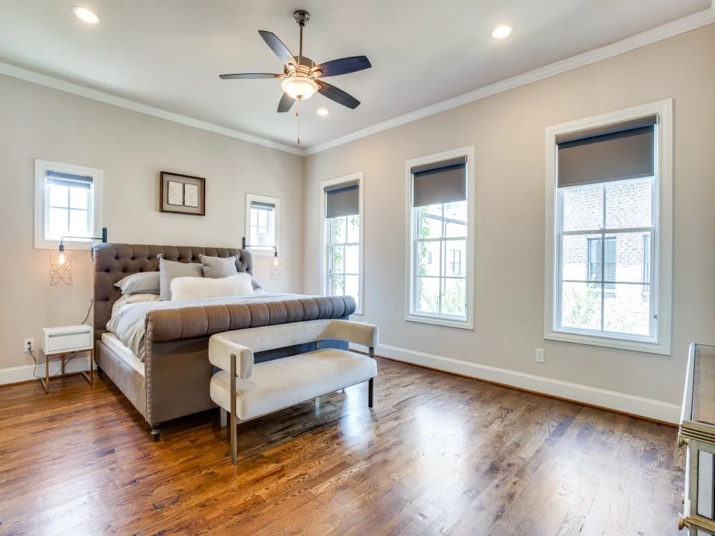 Recessed ceiling lighting, crown molding, wood-finish flooring, ceiling fan, multiple windows