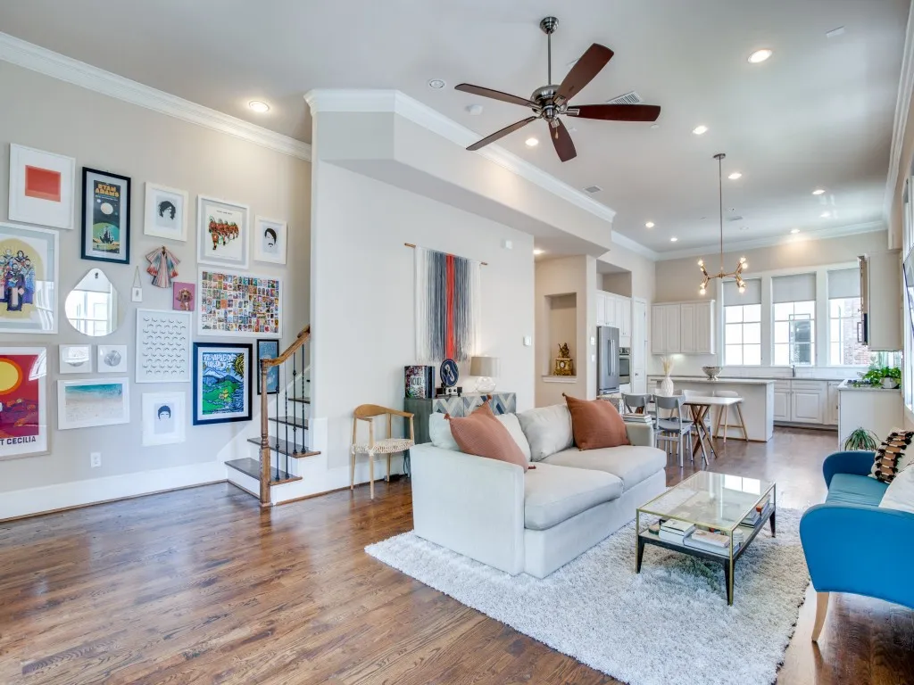 Open-concept living area with dark wood-finish flooring, recessed lighting, and a ceiling fan