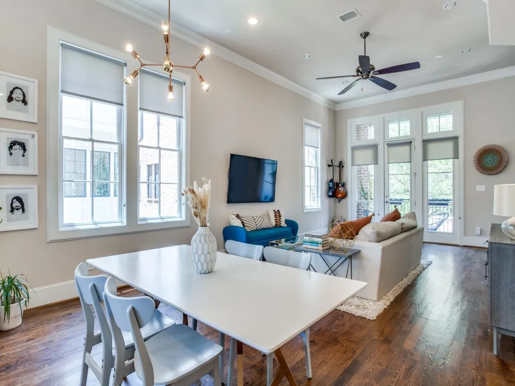 Expansive wood-finish flooring, high ceilings with crown molding, and recessed lighting