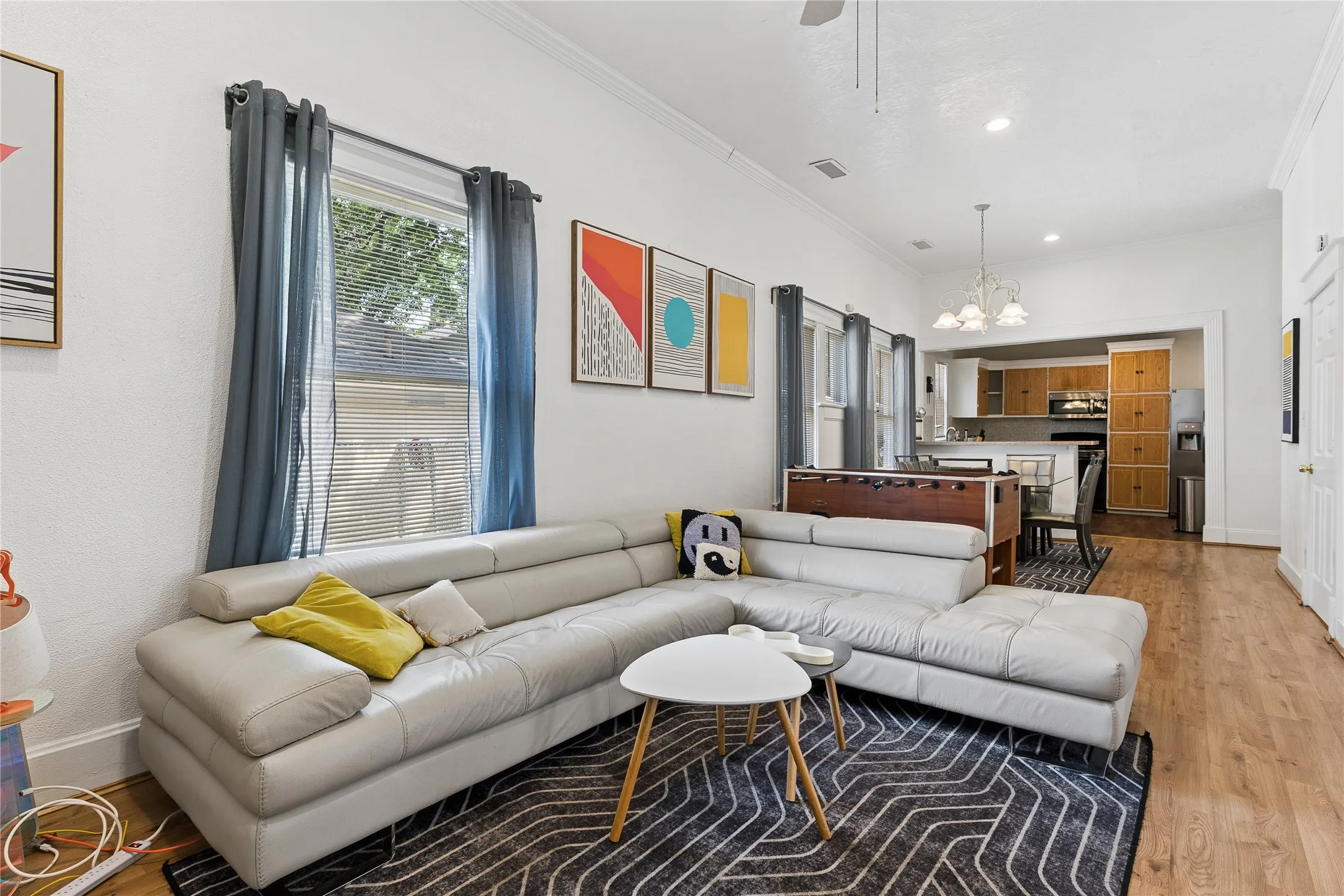 Recessed lighting, wood-finish flooring, and crown molding