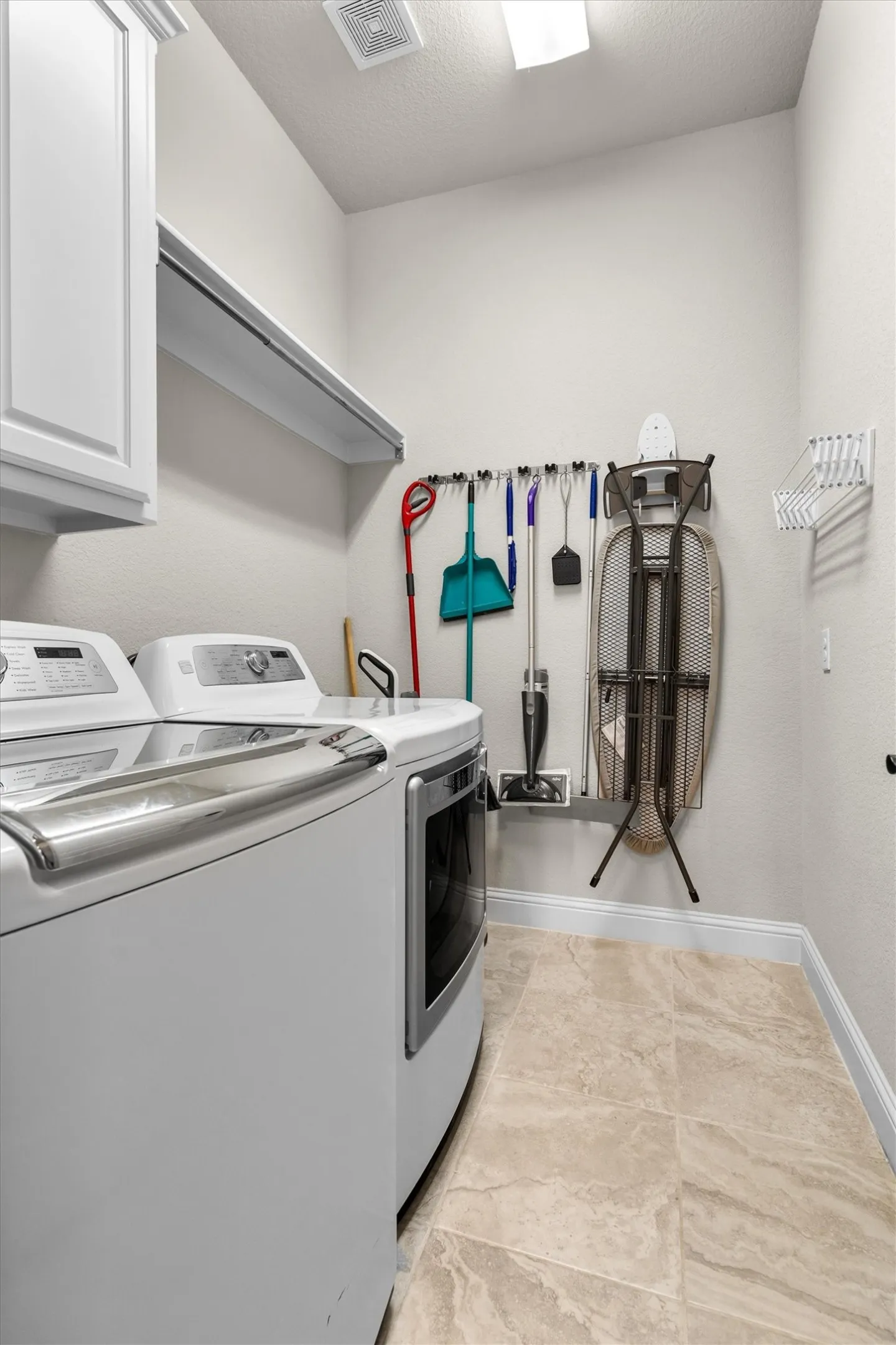 Spacious utility room.  Space for freezer or extra fridge.