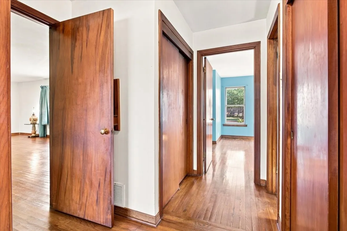 Original reconditioned wood-finish flooring in most of the home, wood doors, and fresh
crisp white wall paint