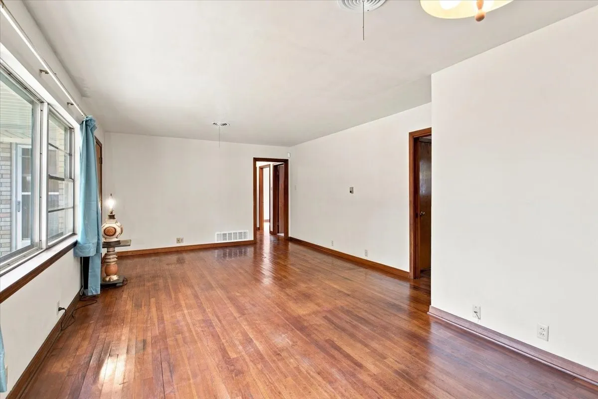 Plenty of natural light in the living dining room featuring hardwood flooring