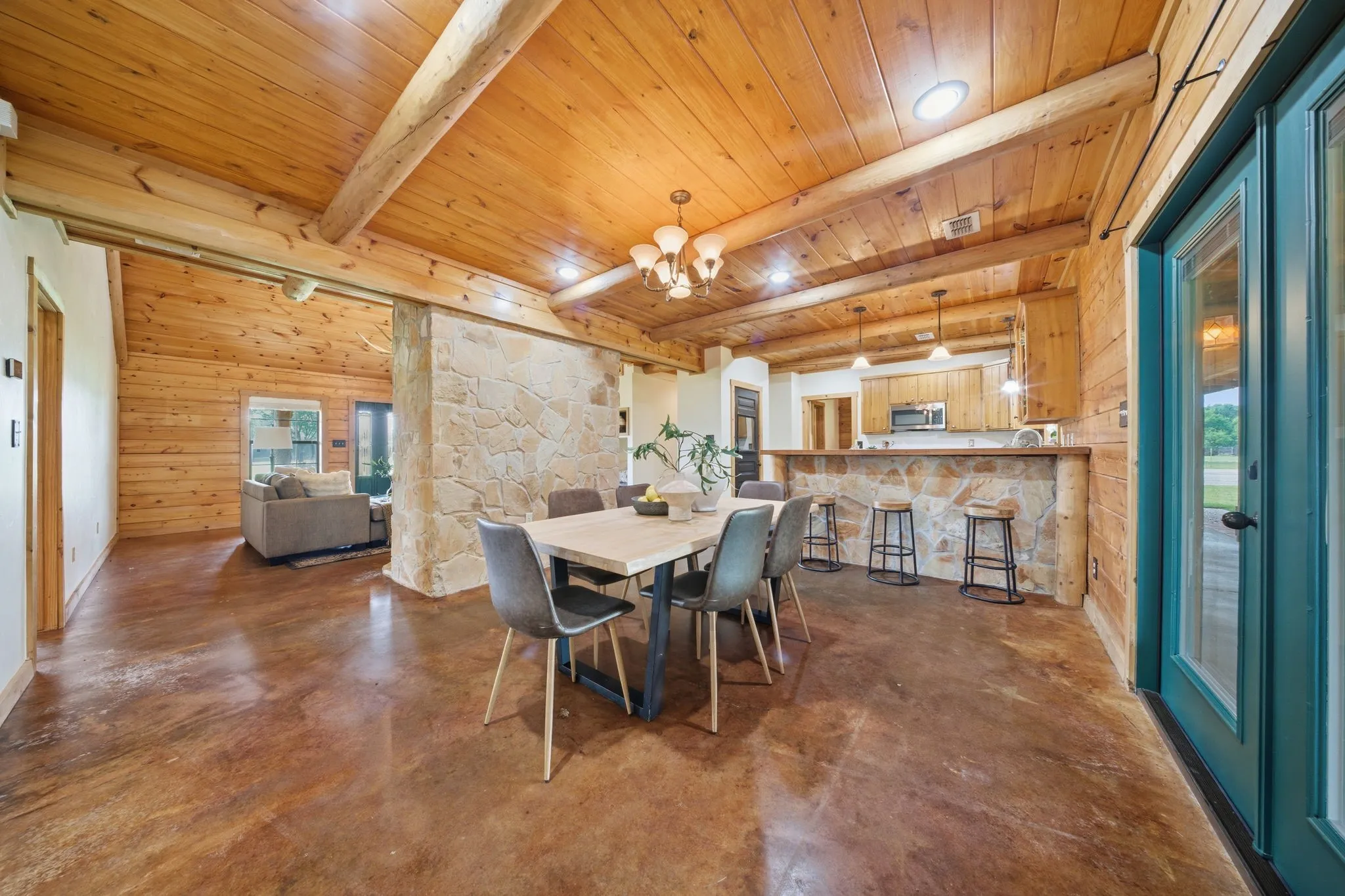 Natural wood plank ceiling with exposed beams