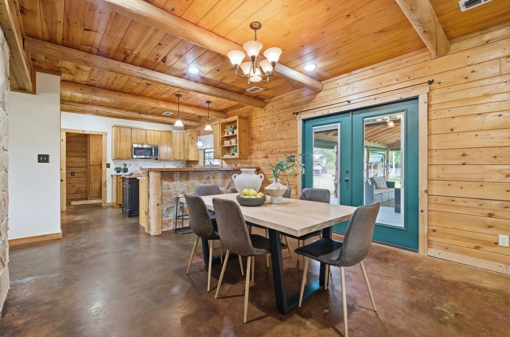 Wood-paneled walls and ceiling with exposed beams