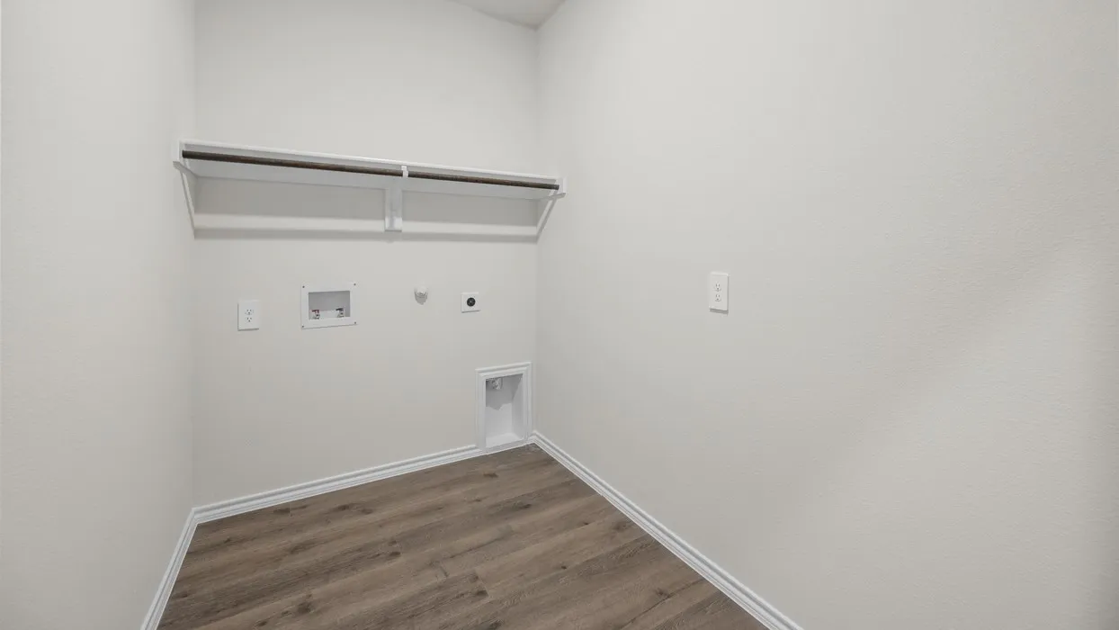 Wood-finish flooring, light-toned walls, and wall-mounted shelving with an integrated rod