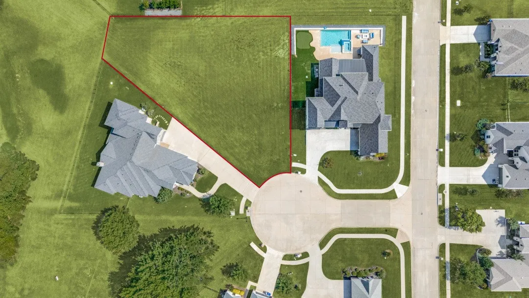 Expansive green lot with established landscaping, situated on a cul-de-sac