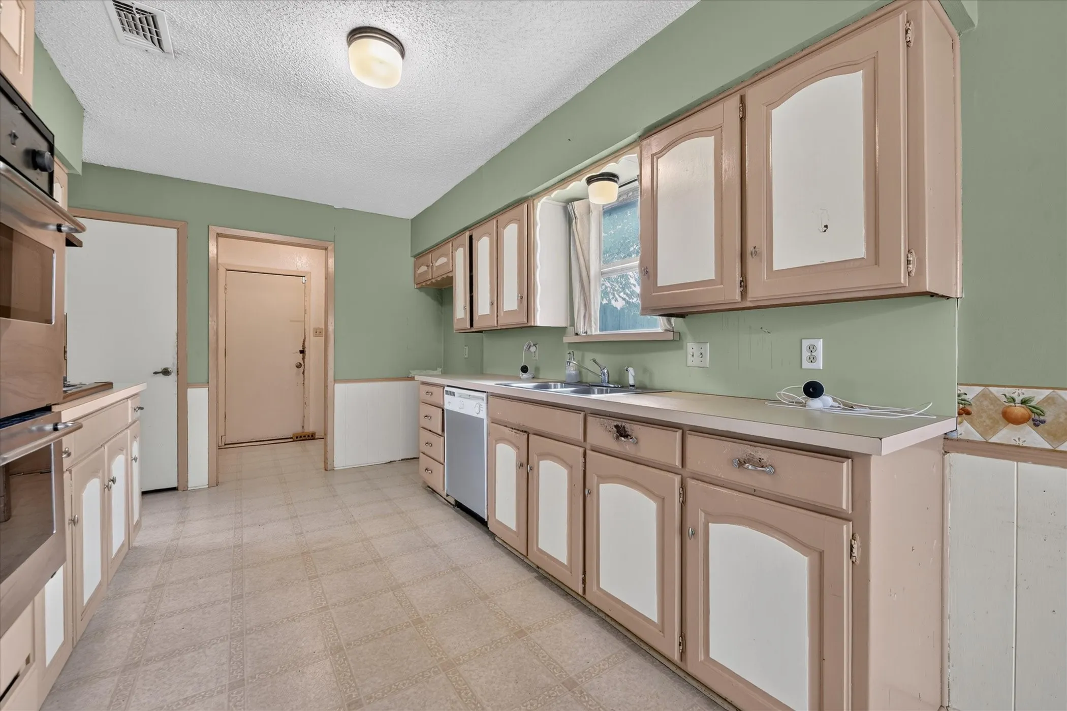 Kitchen with Utility Room and 2- car Garage Access