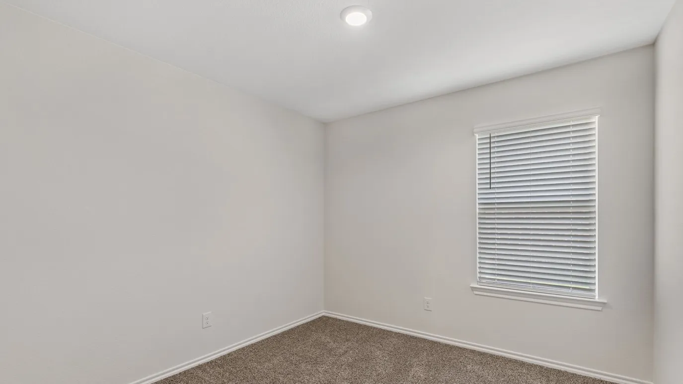 Recessed ceiling lighting, textured wall finish, window with horizontal blinds, and carpeted flooring