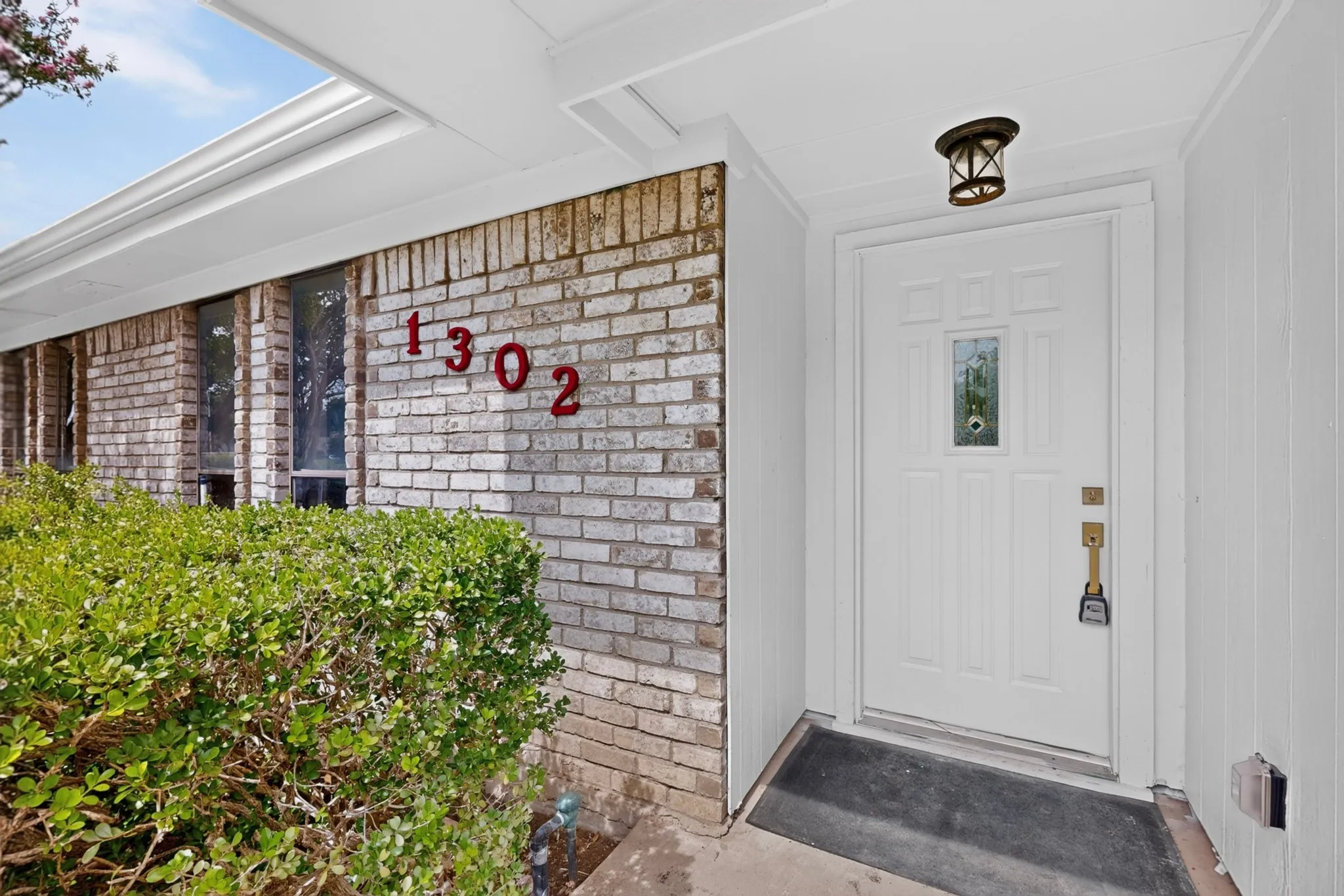 Brick facade with white siding accents