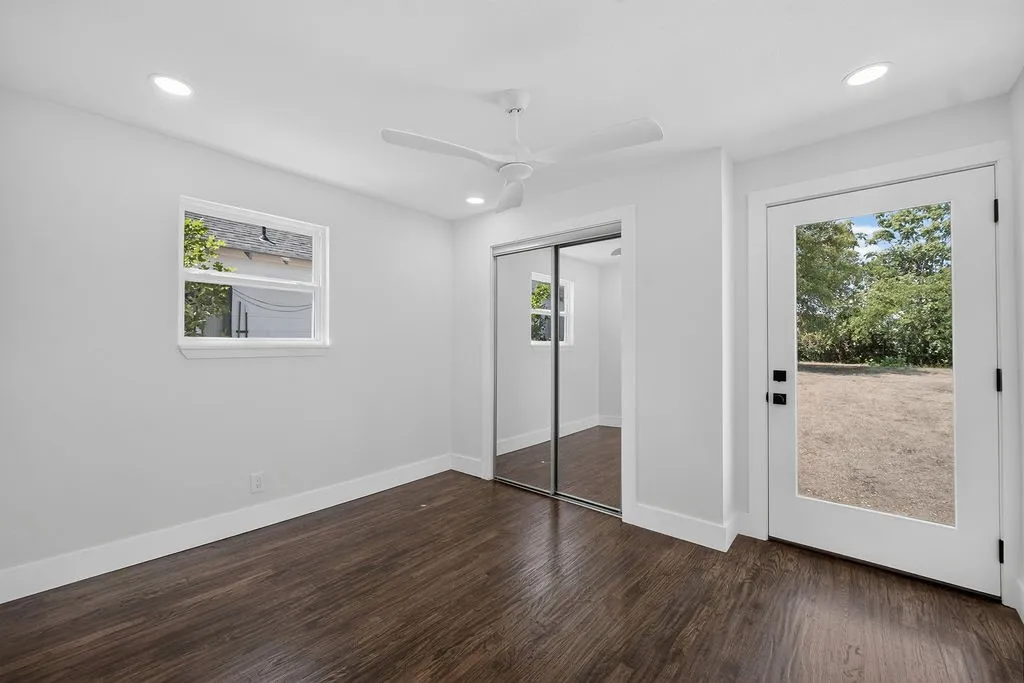 Wood-finish flooring, recessed lighting, and a ceiling fan