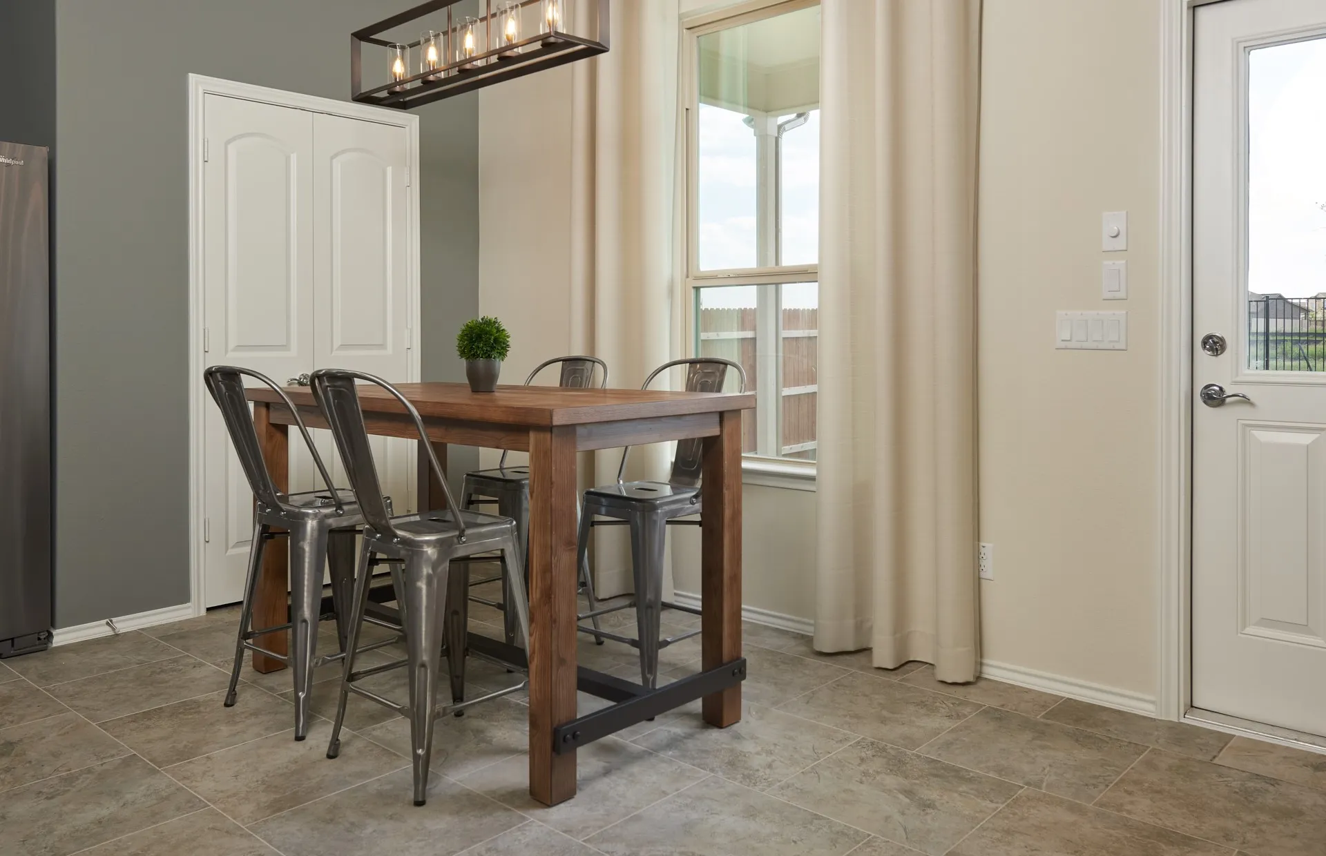 *Model Representation - Dining area off kitchen with large windows