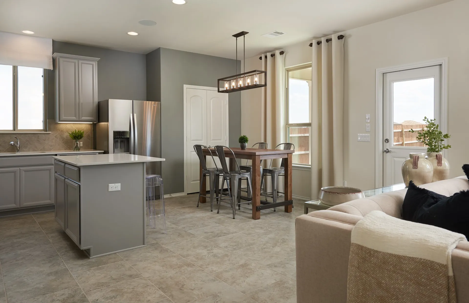 *Model Representation - Large island overlooking gathering room and dining areas