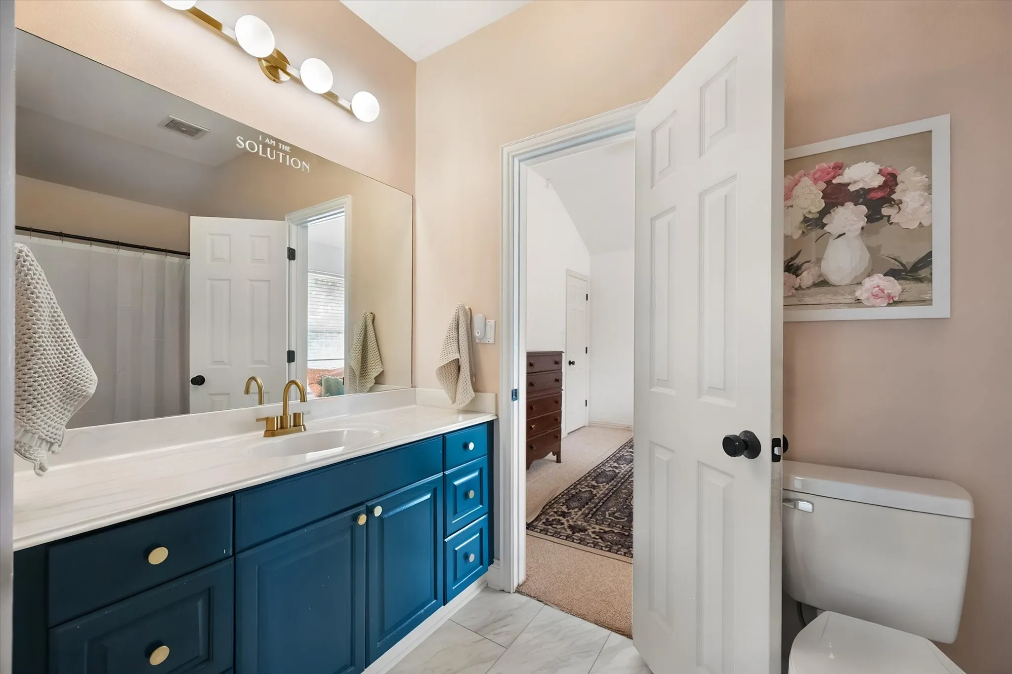 3rd full bathroom has large vanity.