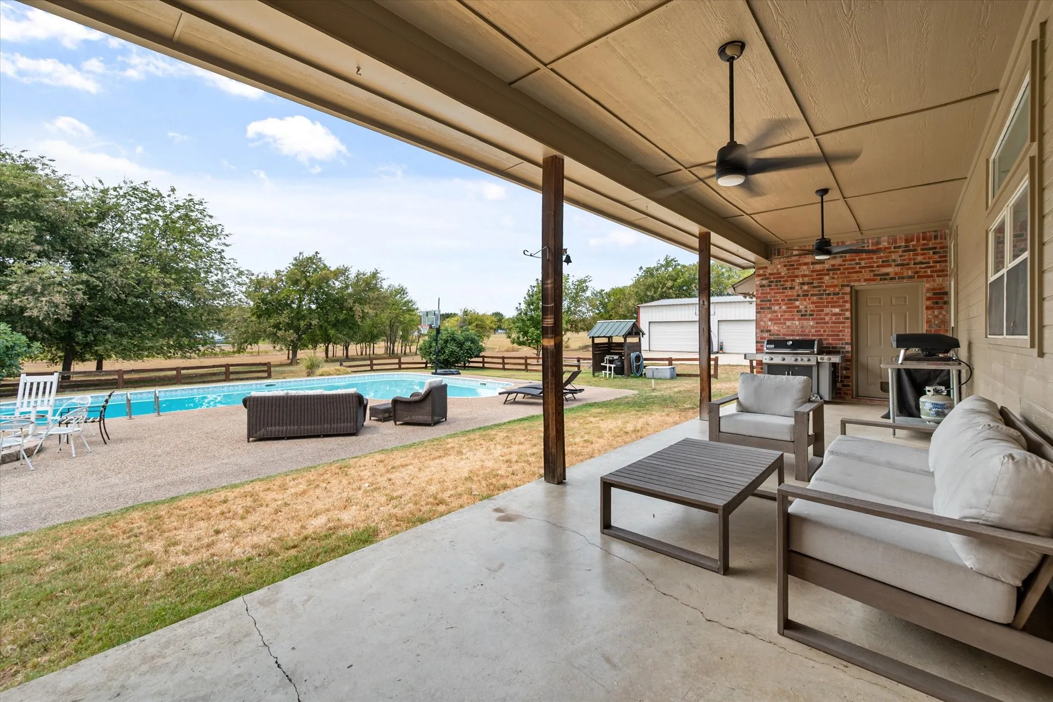 Covered back patio creates an inviting outdoor space!