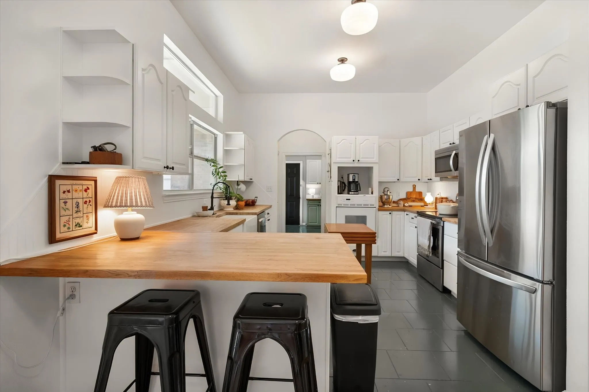Kitchen has butcher block counter tops and lots of cabinet space!