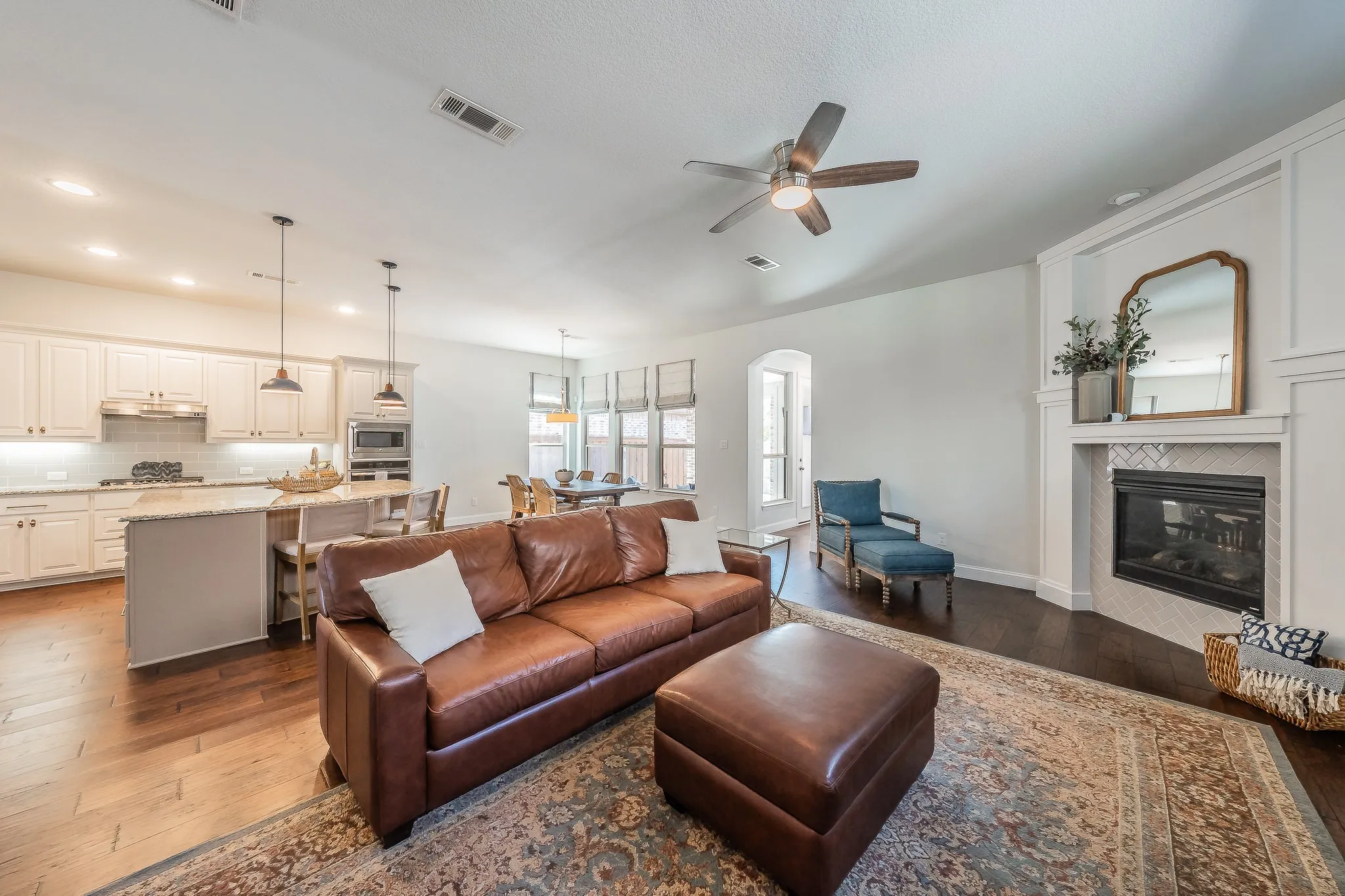 Open concept living area with wood-finish flooring