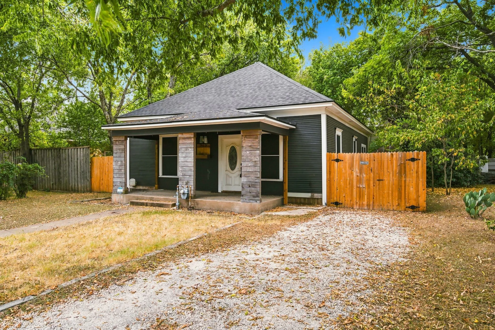 Dark-hued siding exterior with a shingle roof