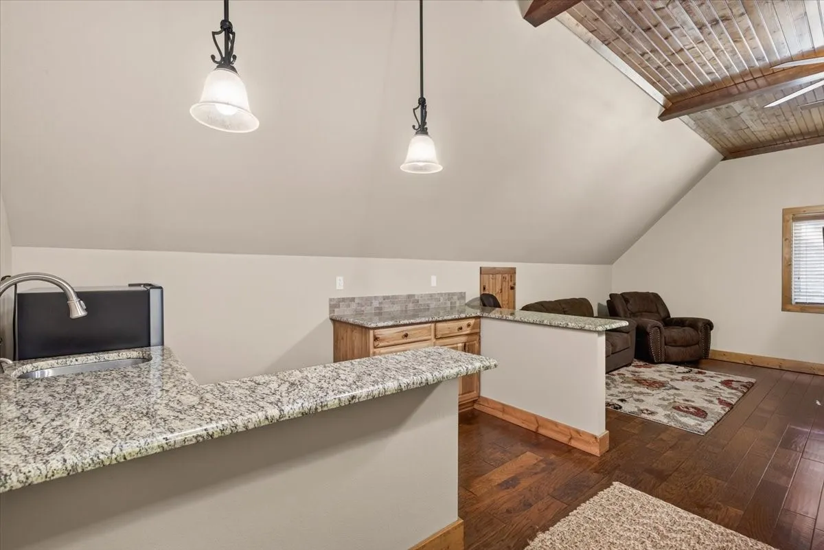 Efficiency apartment up above garage. This unit can be entered through the garage or you could install a hidden bookcase door from an upstairs bedroom!!