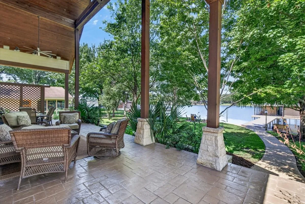 Tongue and groove wood ceilings, huge fans, spider system for less mess and look at these shady lake views!