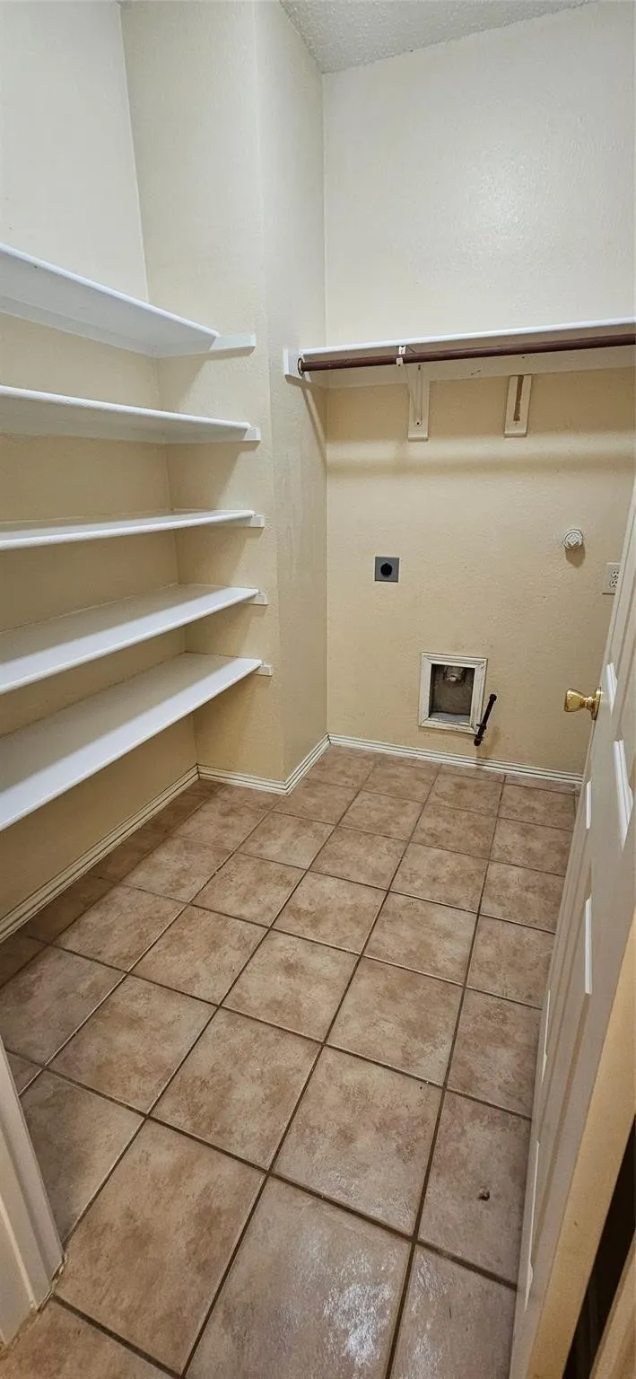 Expansive shelving system, tile flooring, and a clothing rod