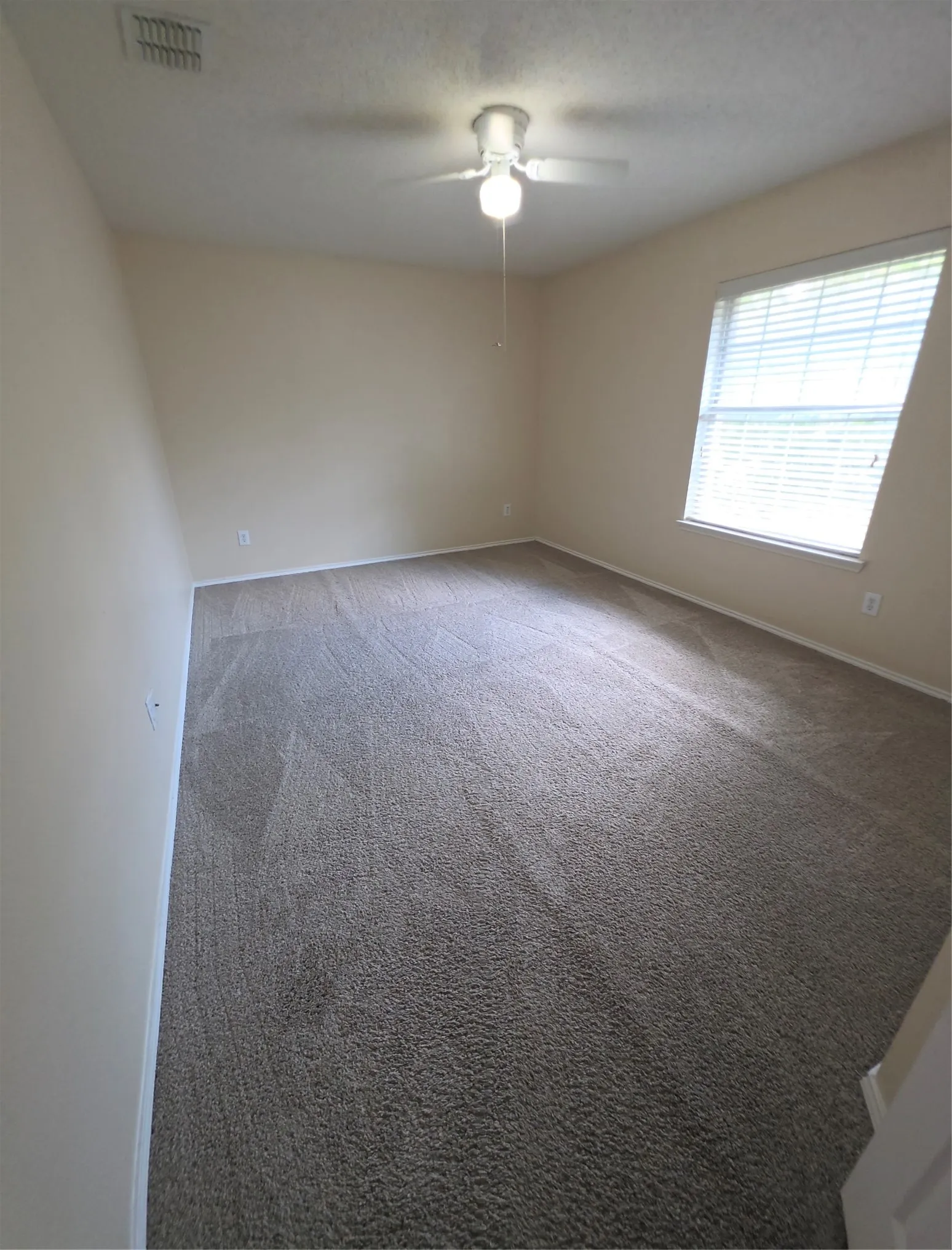 Recessed lighting, ceiling fan, neutral wall paint, window with blinds, and carpeted flooring