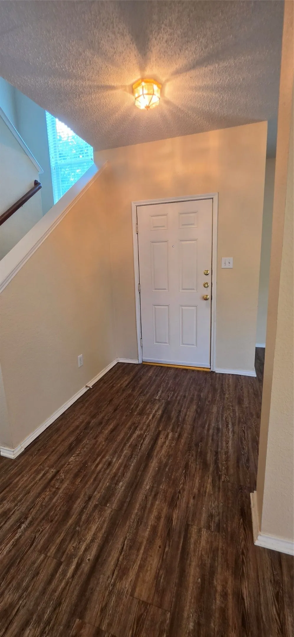 Wood-finish flooring throughout the entry