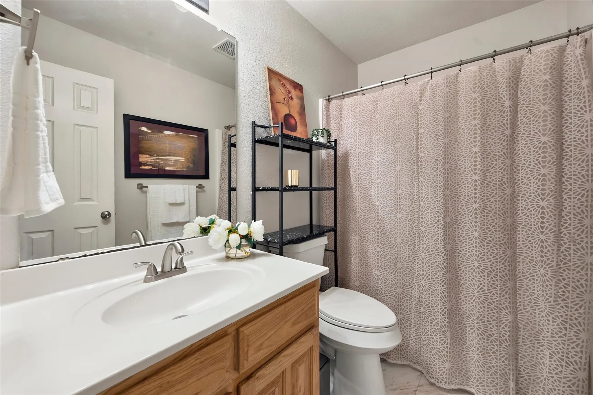 Hall bath located between the secondary bedrooms